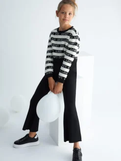 Completo maglia a righe e pantalone nero multi