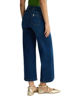 Jeans a gamba flare con inserto elastico sul dietro denim medio