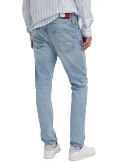 Jeans slim con effetto strappi in denim chiaro